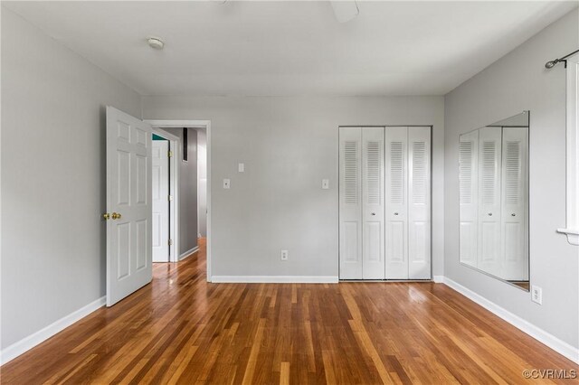 11911 Kilrenny Rd, Midlothian, VA 23113 - unfurnished bedroom featuring wood finished floors, baseboards, and ceiling fan