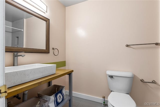 11911 Kilrenny Rd, Midlothian, VA 23113 - bathroom featuring a sink, toilet, and baseboards