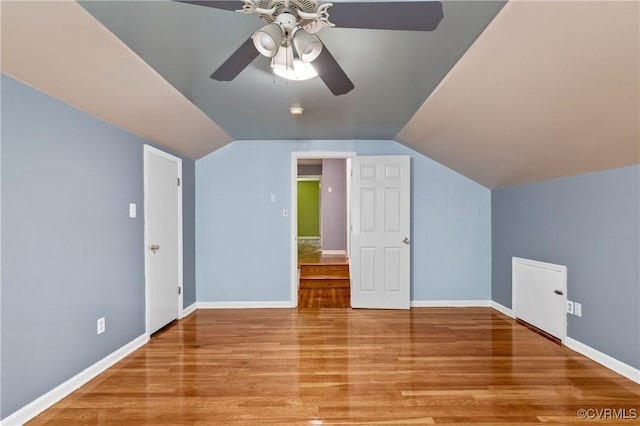 11911 Kilrenny Rd, Midlothian, VA 23113 - bonus room featuring wood finished floors, vaulted ceiling, a ceiling fan, and baseboards