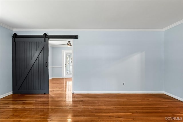 11911 Kilrenny Rd, Midlothian, VA 23113 - spare room featuring crown molding, baseboards, wood finished floors, and a barn door