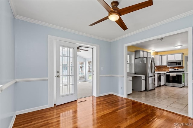 11911 Kilrenny Rd, Midlothian, VA 23113 - kitchen with appliances with stainless steel finishes, a ceiling fan, light wood finished floors, light countertops, and baseboards