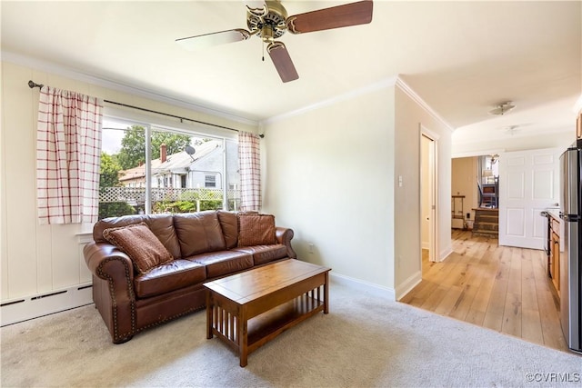 3513 Patrick Ave, Richmond, VA 23222 - living area featuring ornamental molding, a baseboard radiator, a ceiling fan, baseboards, and light colored carpet