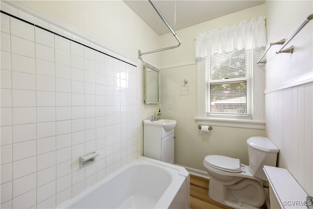 3513 Patrick Ave, Richmond, VA 23222 - bathroom featuring toilet, vanity, wood finished floors, and bathing tub / shower combination
