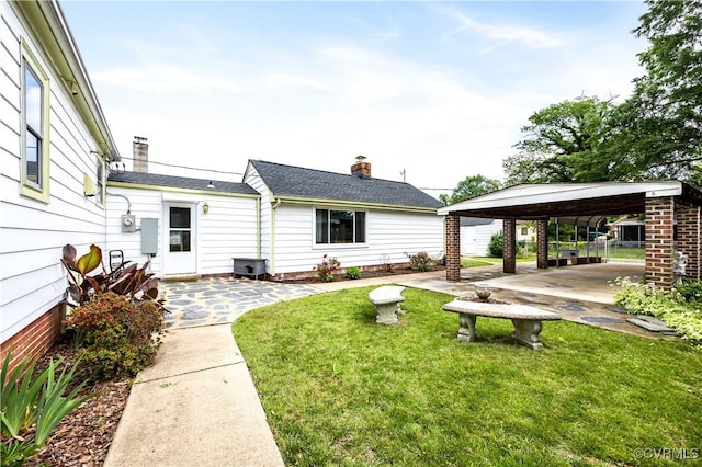 3513 Patrick Ave, Richmond, VA 23222 - rear view of property featuring a lawn and a chimney