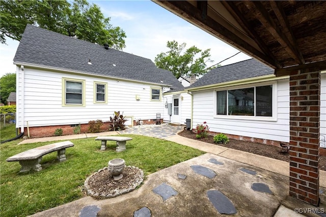 3513 Patrick Ave, Richmond, VA 23222 - back of house with roof with shingles, a patio area, and a yard