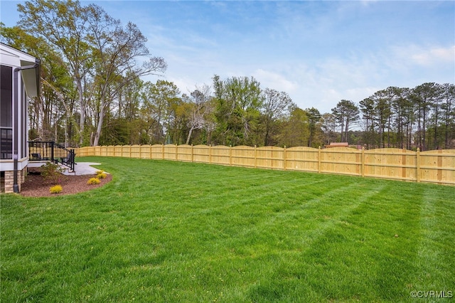 8900 Burkhart Dr, Henrico, VA 23229 - view of yard featuring a sunroom and view of wooded area