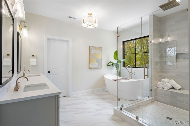 8900 Burkhart Dr, Henrico, VA 23229 - full bath featuring a shower stall, a freestanding bath, double vanity, marble finish floors, and baseboards