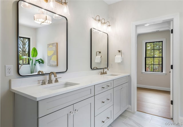 8900 Burkhart Dr, Henrico, VA 23229 - bathroom with double vanity and baseboards