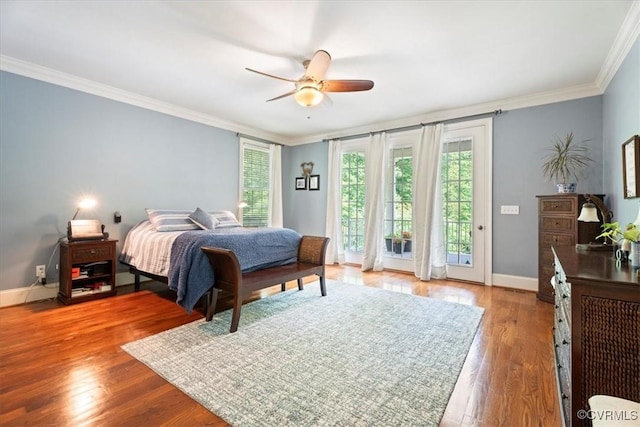 11470 Jack Ln, Hanover, VA 23146 - bedroom featuring multiple windows, ornamental molding, access to outside, wood finished floors, and baseboards