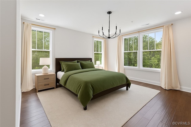 1702 Old Brick Rd Unit B, Glen Allen, VA 23060 - bedroom featuring multiple windows, dark wood-style flooring, and a chandelier
