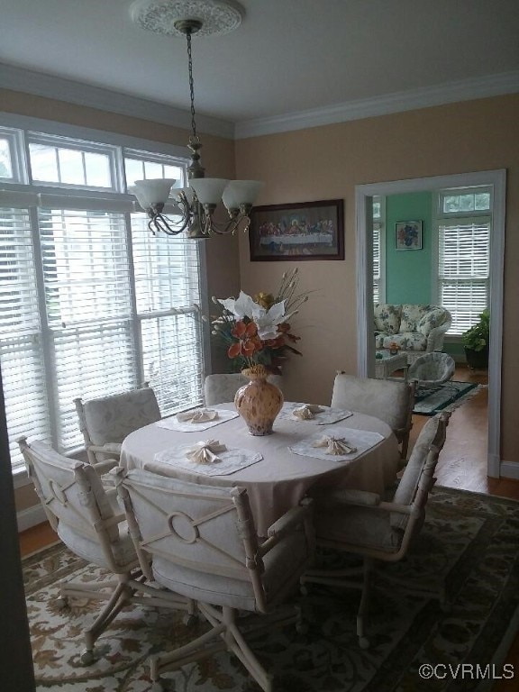 2401 Bell Tower Pl, Henrico, VA 23233 - dining area with a chandelier, ornamental molding, healthy amount of natural light, and wood finished floors