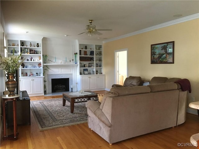 2401 Bell Tower Pl, Henrico, VA 23233 - living area with ceiling fan, ornamental molding, wood finished floors, a fireplace, and built in features