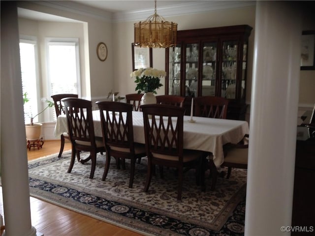 2401 Bell Tower Pl, Henrico, VA 23233 - dining space with a chandelier, wood finished floors, and ornamental molding