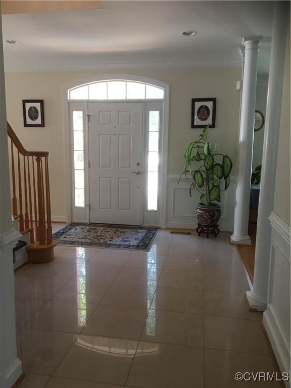 2401 Bell Tower Pl, Henrico, VA 23233 - foyer entrance featuring ornate columns, healthy amount of natural light, stairway, a wainscoted wall, and a decorative wall