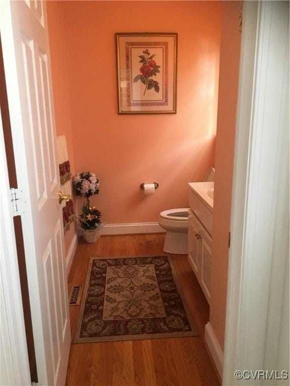 2401 Bell Tower Pl, Henrico, VA 23233 - bathroom with vanity, wood finished floors, toilet, and baseboards