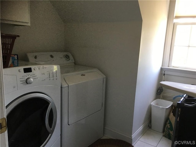 2401 Bell Tower Pl, Henrico, VA 23233 - washroom featuring washing machine and clothes dryer, light tile patterned flooring, and baseboards