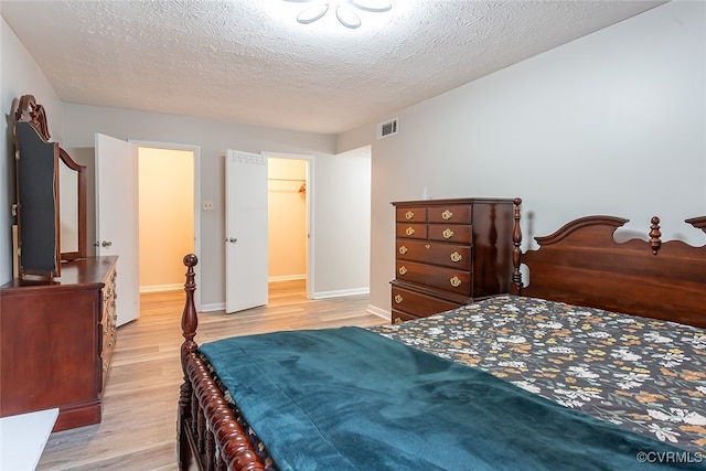 1500 Largo Rd Unit 201, Henrico, VA 23238 - bedroom with wood finished floors, baseboards, and a textured ceiling