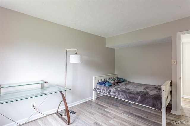 1500 Largo Rd Unit 201, Henrico, VA 23238 - bedroom featuring wood finished floors, baseboards, and a textured ceiling