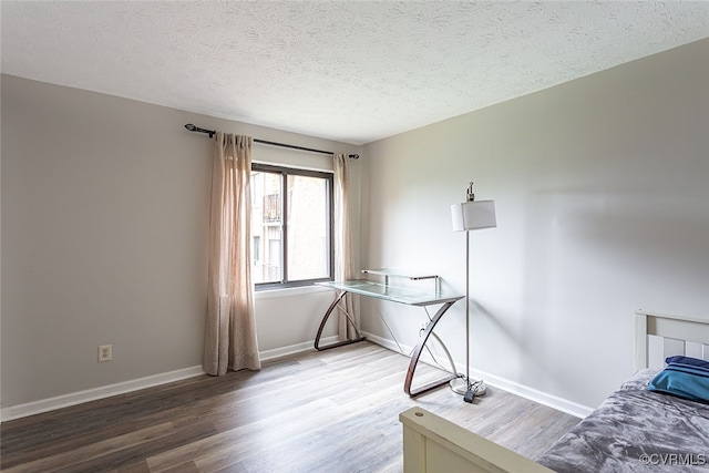 1500 Largo Rd Unit 201, Henrico, VA 23238 - bedroom with wood finished floors, a textured ceiling, and baseboards