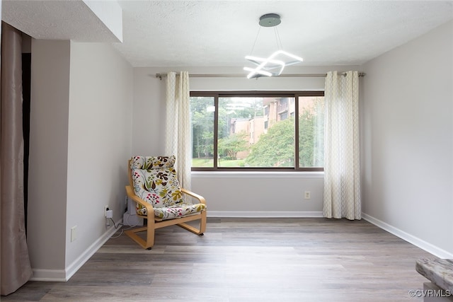 1500 Largo Rd Unit 201, Henrico, VA 23238 - living area with a chandelier, wood finished floors, and baseboards