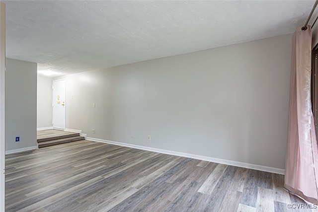 1500 Largo Rd Unit 201, Henrico, VA 23238 - spare room featuring wood finished floors, a textured ceiling, and baseboards