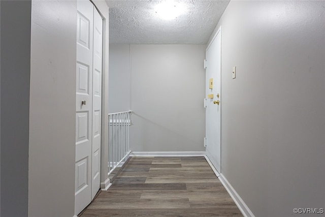 1500 Largo Rd Unit 201, Henrico, VA 23238 - corridor featuring wood finished floors, a textured ceiling, and baseboards