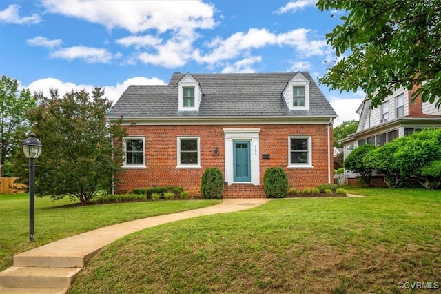 3204 Griffin Ave, Richmond, VA 23222 - cape cod house featuring entry steps, brick siding, and a front lawn
