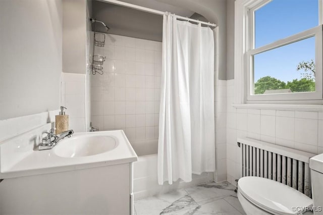3204 Griffin Ave, Richmond, VA 23222 - full bathroom with marble look tile flooring, toilet, tile walls, radiator, and shower / bath combination with curtain