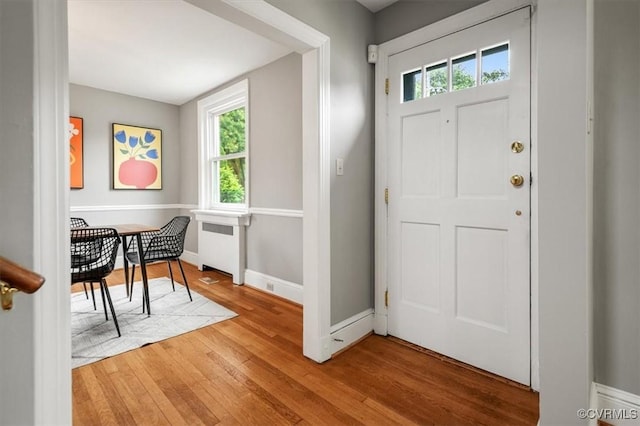 3204 Griffin Ave, Richmond, VA 23222 - entryway with radiator, healthy amount of natural light, wood finished floors, and baseboards