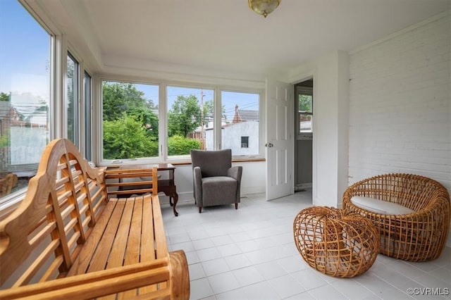 3204 Griffin Ave, Richmond, VA 23222 - sunroom / solarium featuring tile patterned flooring, healthy amount of natural light, and brick wall