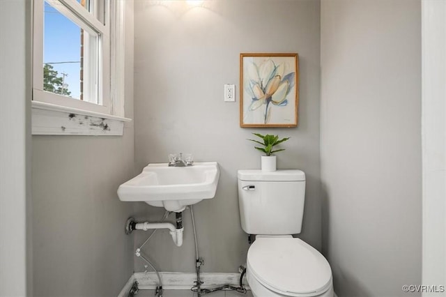3204 Griffin Ave, Richmond, VA 23222 - half bathroom with toilet, baseboards, and a sink