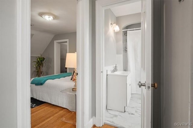 3204 Griffin Ave, Richmond, VA 23222 - bedroom featuring a sink, lofted ceiling, and ensuite bath