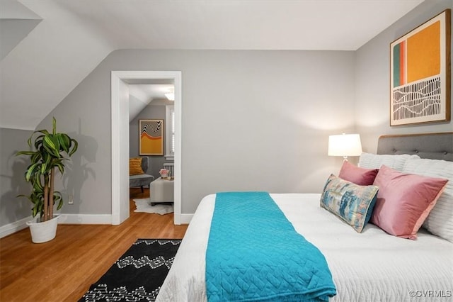 3204 Griffin Ave, Richmond, VA 23222 - bedroom with wood finished floors, vaulted ceiling, and baseboards