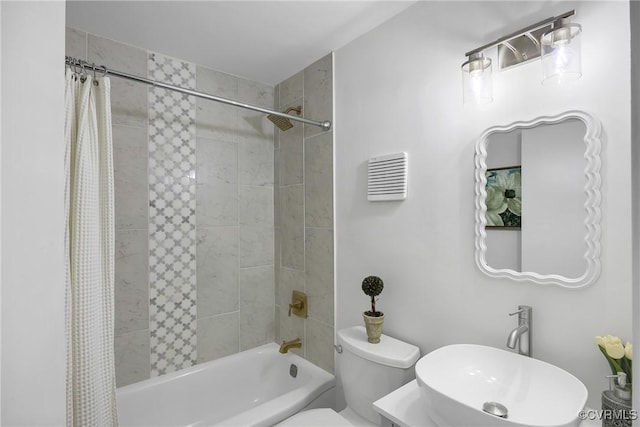 5612 Indigo Rd, Henrico, VA 23230 - bathroom featuring shower / bath combo, toilet, and a sink