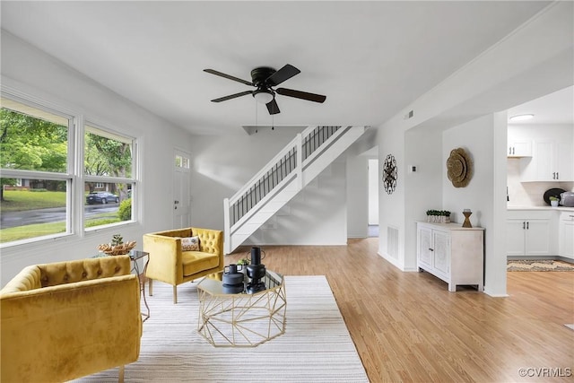 5612 Indigo Rd, Henrico, VA 23230 - living room with stairway, ceiling fan, light wood-type flooring, and baseboards