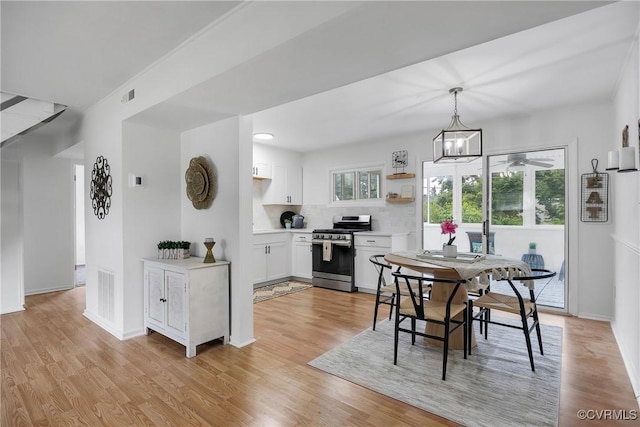 5612 Indigo Rd, Henrico, VA 23230 - dining room with light wood-style floors, baseboards, and a ceiling fan