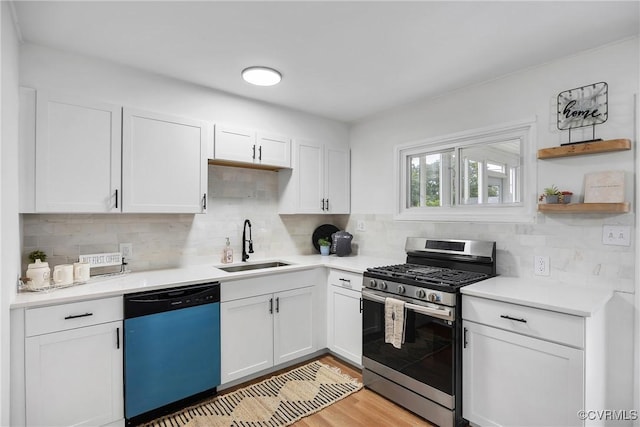 5612 Indigo Rd, Henrico, VA 23230 - kitchen featuring stainless steel gas range, dishwashing machine, a sink, white cabinetry, and light countertops