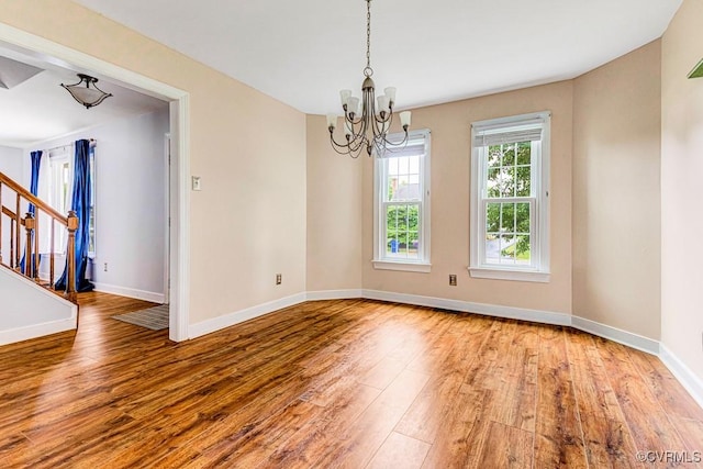9214 Hunters Chase Dr, Mechanicsville, VA 23116 - unfurnished room with hardwood / wood-style floors, stairs, a chandelier, and baseboards