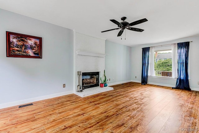 9214 Hunters Chase Dr, Mechanicsville, VA 23116 - unfurnished living room with wood finished floors, a fireplace, ceiling fan, and baseboards