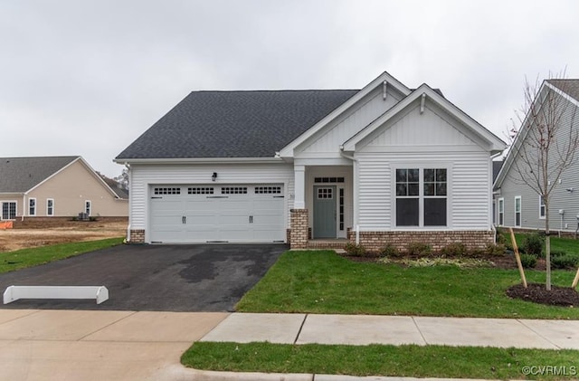 000 Stavely Rd, Chester, VA 23831 - craftsman-style home featuring driveway, board and batten siding, an attached garage, a front lawn, and brick siding