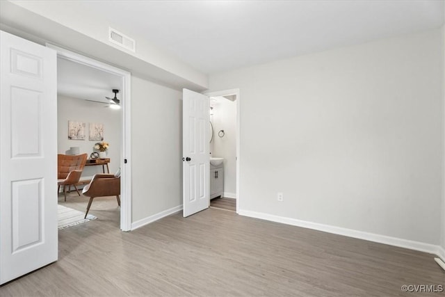 3207 Mark Rd, Richmond, VA 23234 - bedroom featuring light wood-style floors, baseboards, and a desk