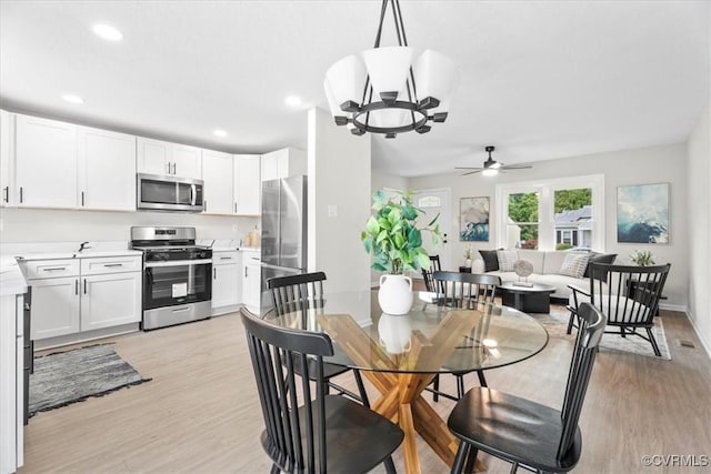 3207 Mark Rd, Richmond, VA 23234 - dining space with light wood finished floors, a ceiling fan, a chandelier, and recessed lighting
