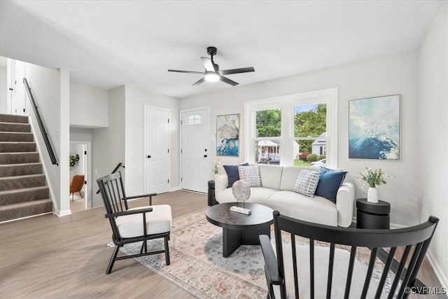 3207 Mark Rd, Richmond, VA 23234 - living area featuring a ceiling fan, light wood-type flooring, baseboards, and stairs