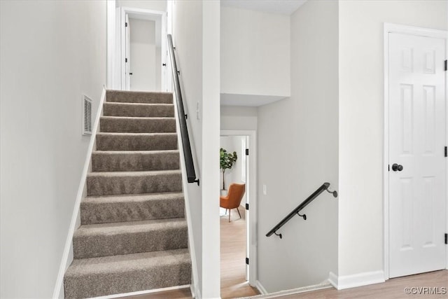 3207 Mark Rd, Richmond, VA 23234 - stairway with baseboards and wood finished floors