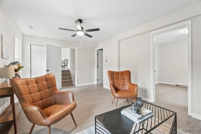 3207 Mark Rd, Richmond, VA 23234 - living room with a ceiling fan, light wood-style floors, stairs, and baseboards