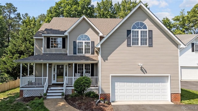 3724 Liberty Point Dr, Midlothian, VA 23112 - traditional home featuring an attached garage, asphalt driveway, covered porch, and roof with shingles