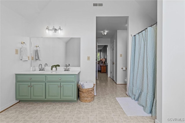 3724 Liberty Point Dr, Midlothian, VA 23112 - bathroom with double vanity, toilet, baseboards, and a shower with shower curtain