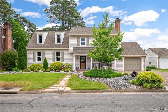 1146 Wicker Dr, Colonial Heights, VA 23834 - view of front of home featuring a front lawn, a chimney, an attached garage, a shingled roof, and driveway