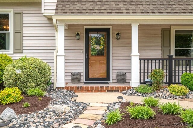 1146 Wicker Dr, Colonial Heights, VA 23834 - doorway to property featuring roof with shingles and a porch