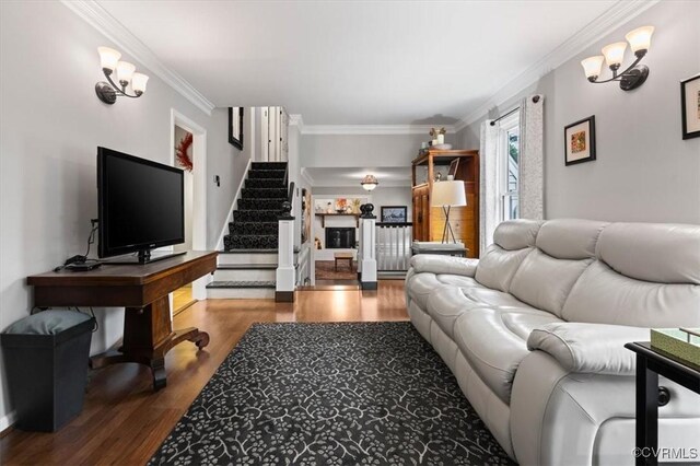 1146 Wicker Dr, Colonial Heights, VA 23834 - living area featuring wood finished floors, stairs, and crown molding